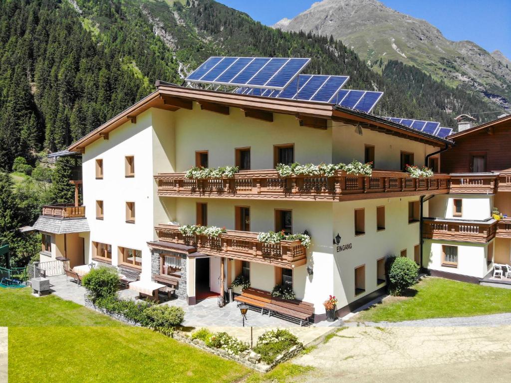 a house with solar panels on the roof at Apartment Köfels-5 by Interhome in Köfles