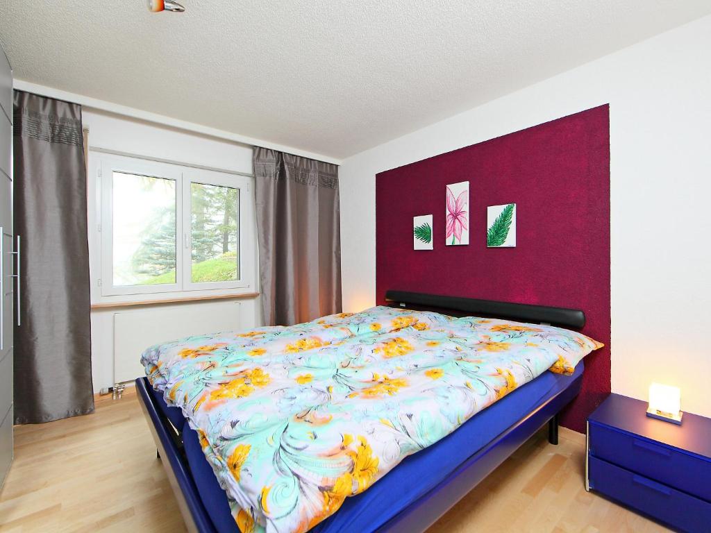 Postel nebo postele na pokoji v ubytování Apartment Sonnhalde B by Interhome