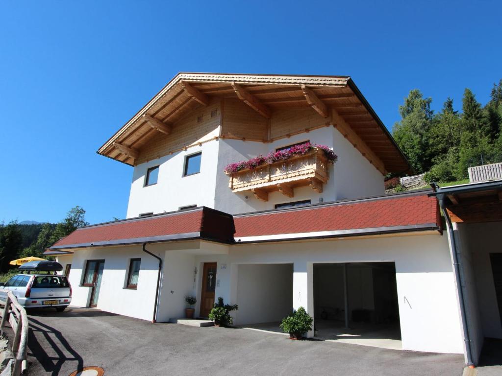 a large white building with a roof at Apartment Hanna by Interhome in Kaltenbach