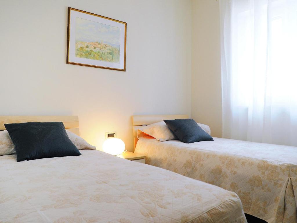 Postel nebo postele na pokoji v ubytování Villa Lucija by Interhome