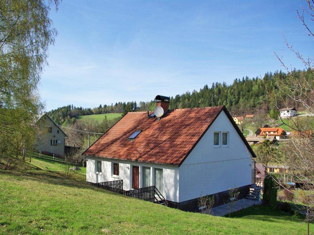 a small white house with a chimney on top of it at Holiday Home Valasska Bystrice by Interhome in Valašská Bystřice