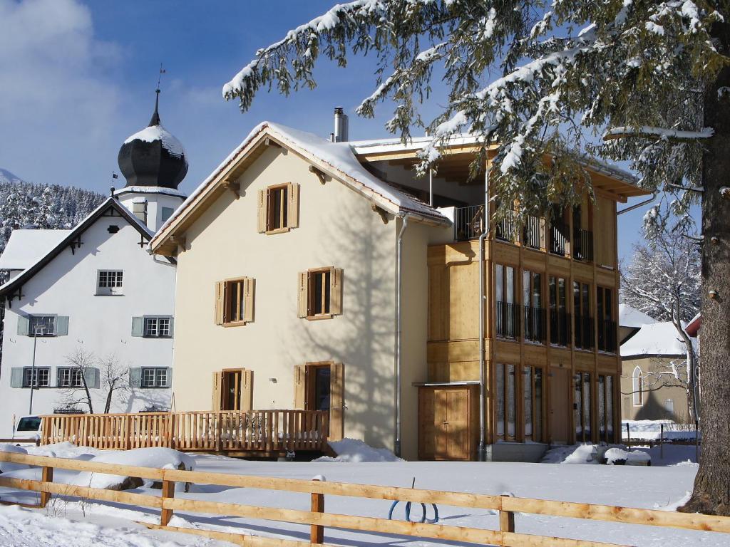 a house in the snow with a fence at Holiday Home von Capeller by Interhome in Parpan