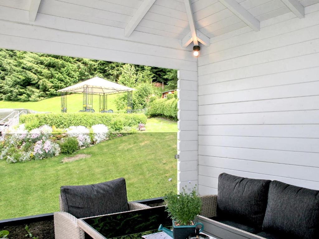 a patio with two chairs and a gazebo at Apartment Poldi by Interhome in Haus im Ennstal