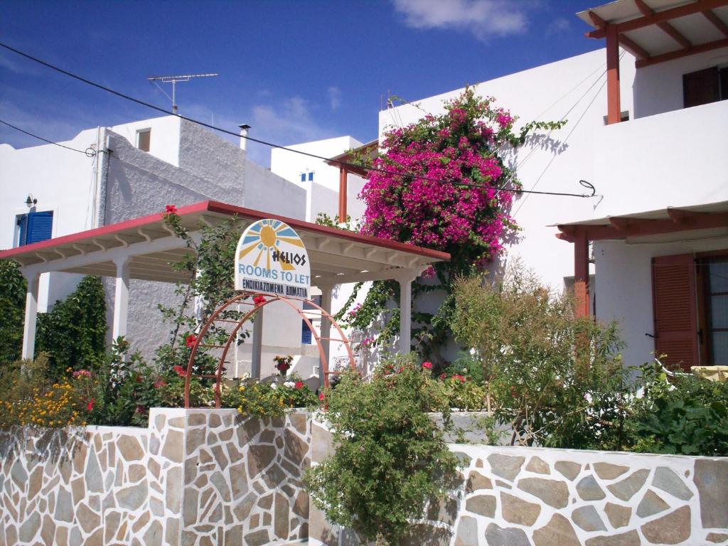 a house with a sign in front of it at Helios Serifos in Livadi
