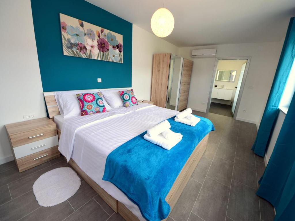Postel nebo postele na pokoji v ubytování Holiday Home West by Interhome