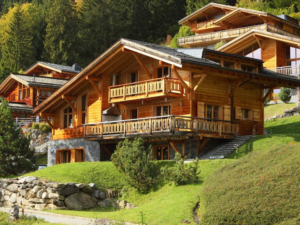 a large wooden house on top of a hill at Chalet Chalet Maurice by Interhome in Chesières