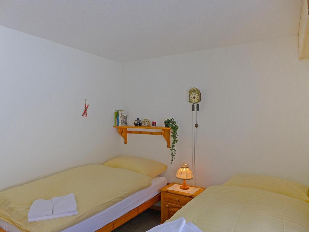 Postel nebo postele na pokoji v ubytování Apartment Rustica Apt- M by Interhome