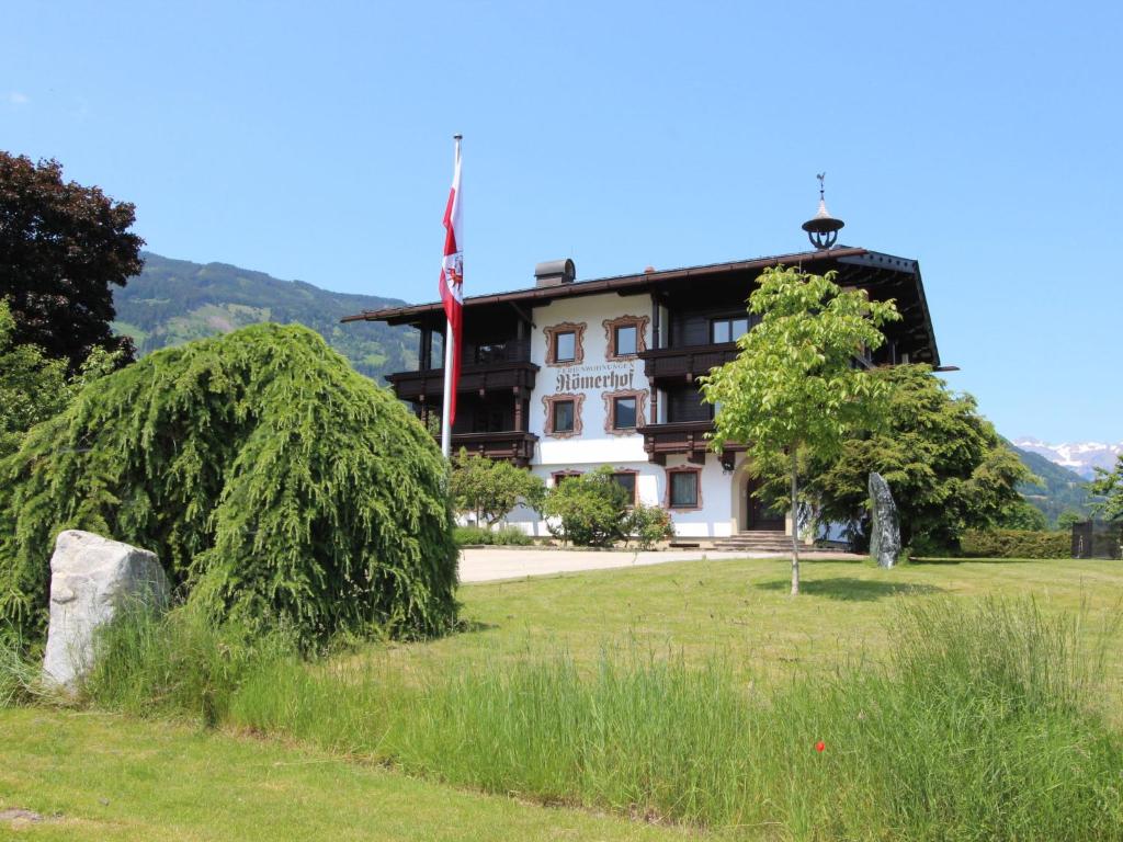 a building with a tree in front of it at Apartment Römerhof-5 by Interhome in Fügen