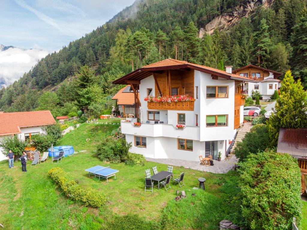 an aerial view of a house in the mountains at Apartment Mundlers Hoamatl-3 by Interhome in Oetz