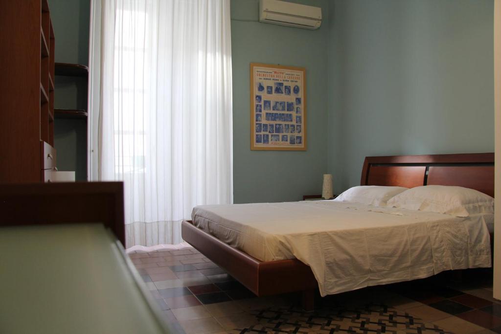 Posteľ alebo postele v izbe v ubytovaní Casa Vacanza Icaros, Ortigia hictoric center, 200 mt from the beach