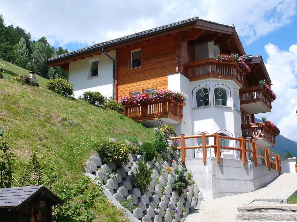 a house on the side of a hill at Chalet Haus Piccolo by Interhome in Saas-Grund