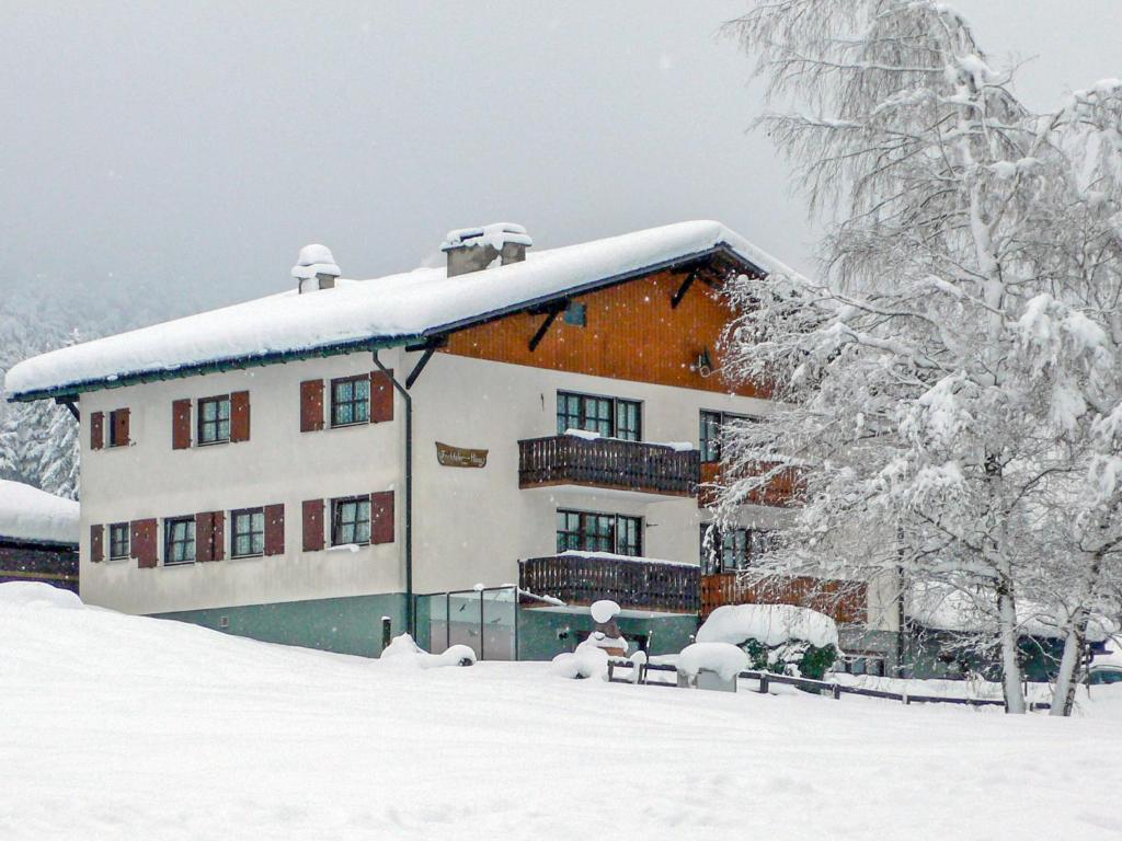 a house covered in snow in front at Apartment Fricktalerhuus Apt-1 by Interhome in Surava