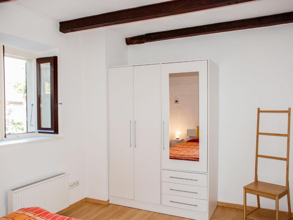 Postel nebo postele na pokoji v ubytování Apartment Ca' dal Pio by Interhome