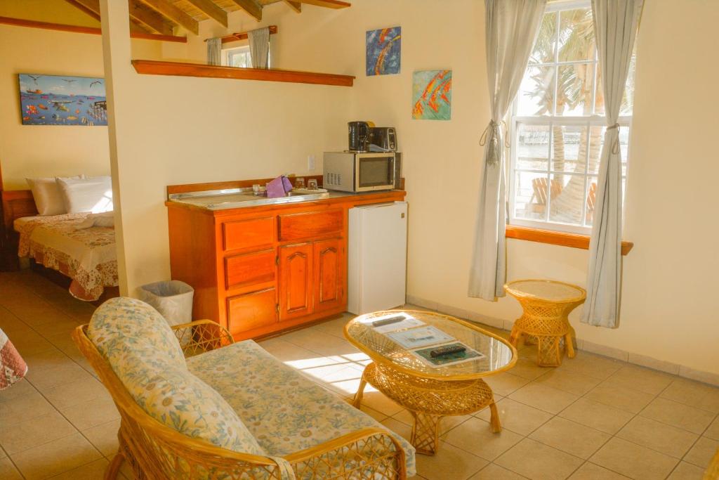 a living room with a couch and a table at Royal Caribbean Resort in San Pedro