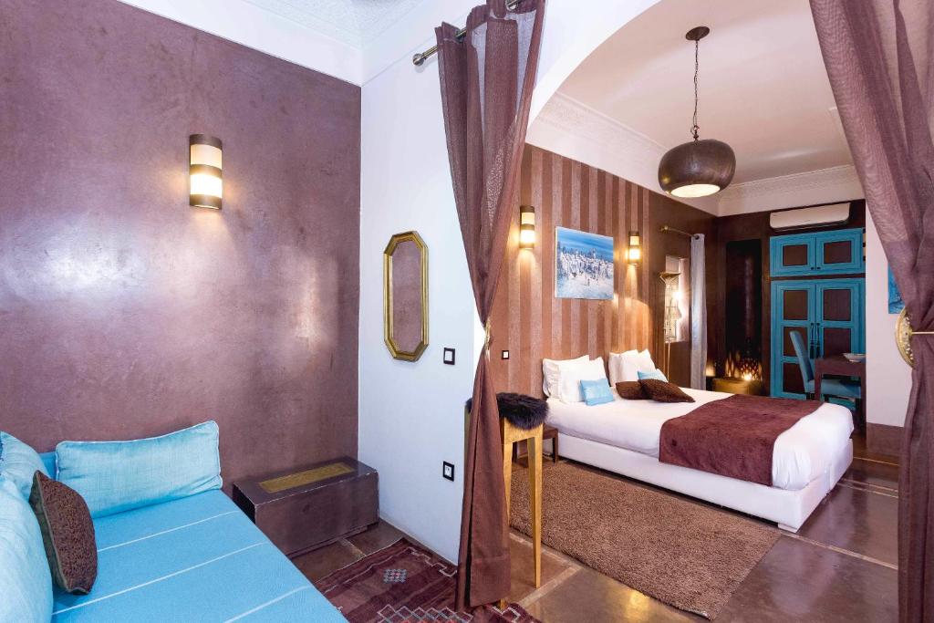 Un pat sau paturi într-o cameră la Riad Mazaya