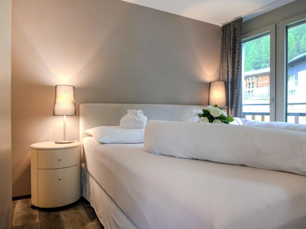 Postel nebo postele na pokoji v ubytování Apartment Dione by Interhome
