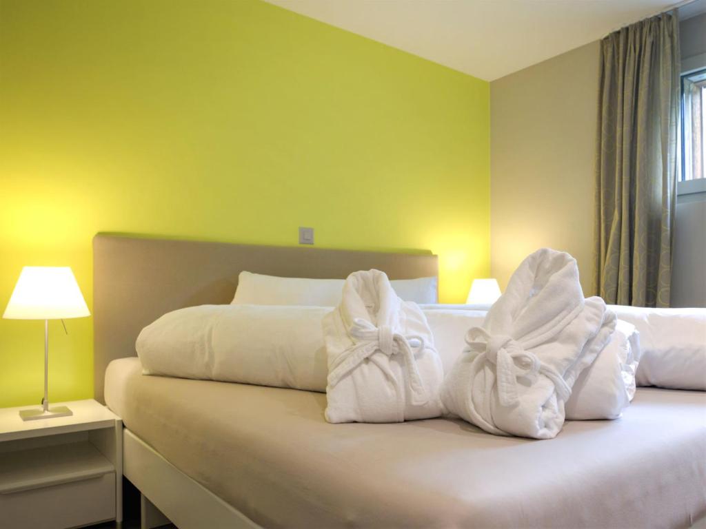 Postel nebo postele na pokoji v ubytování Apartment Dione by Interhome