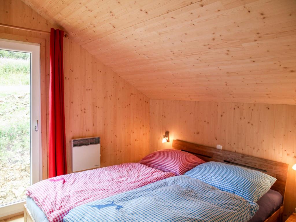Postel nebo postele na pokoji v ubytování Chalet Klippitzrose by Interhome