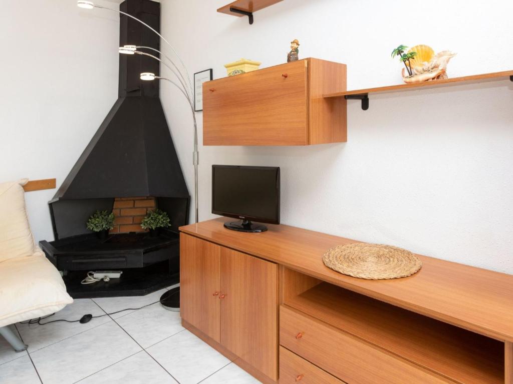 Televízia a/alebo spoločenská miestnosť v ubytovaní Apartment El Gato I by Interhome