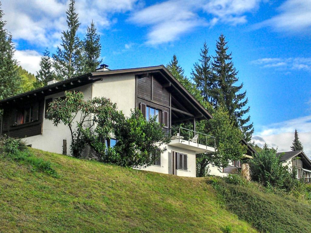 a house sitting on top of a hill at Holiday Home Ferienhaus Gommiswald by Interhome in Gommiswald