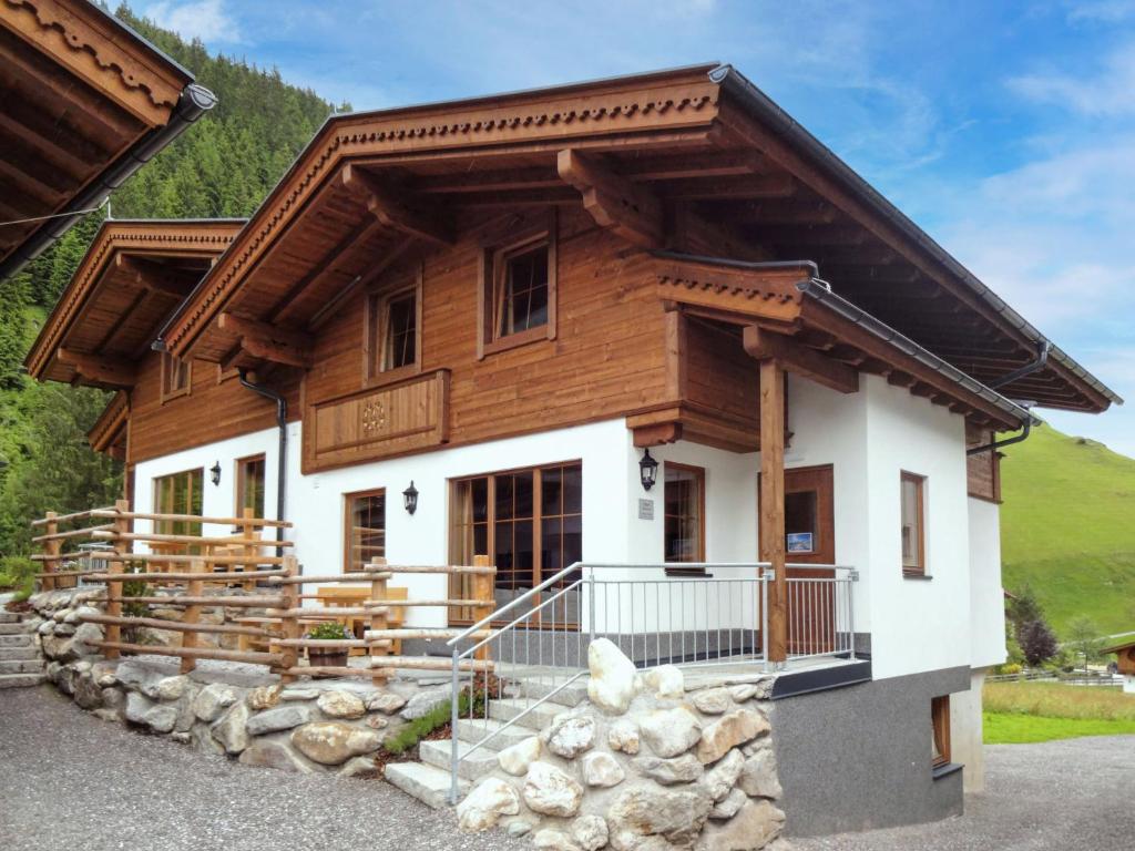 a log house with a gambrel roof at Chalet Chalet Alois by Interhome in Juns