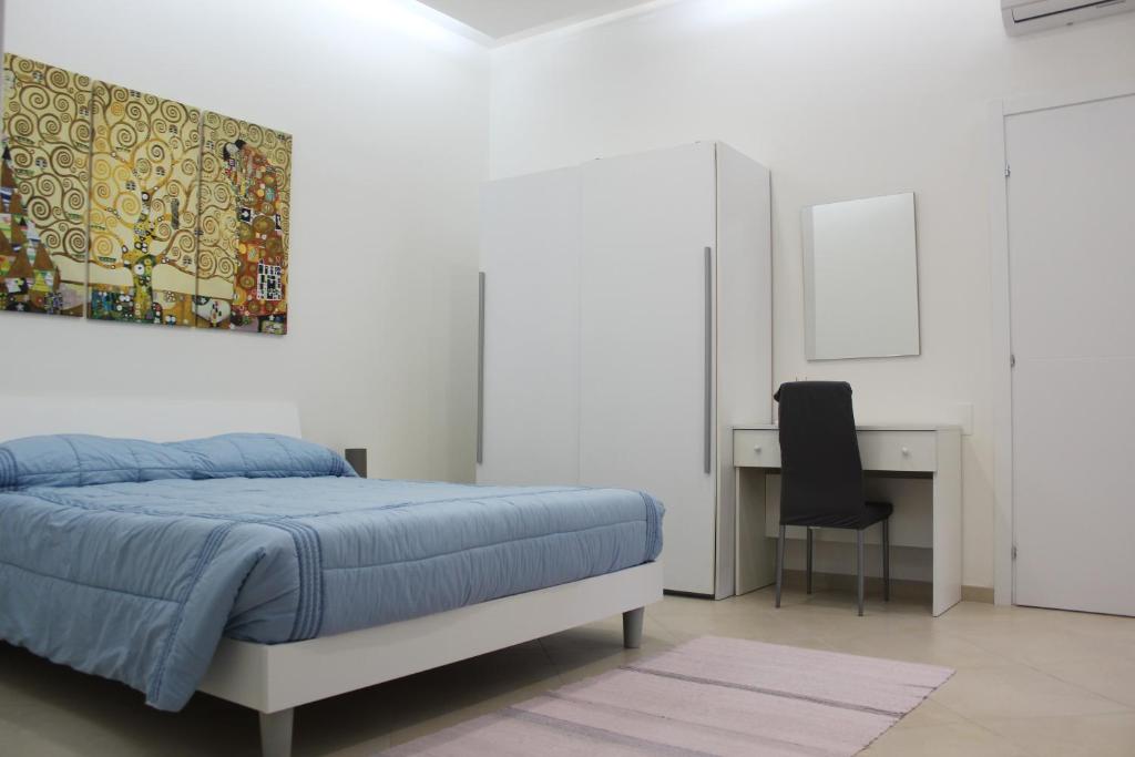 Łóżko lub łóżka w pokoju w obiekcie Agorà-Akrai B&B