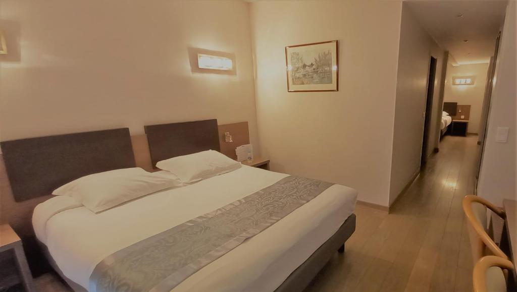 Postel nebo postele na pokoji v ubytování Hotel Poretta