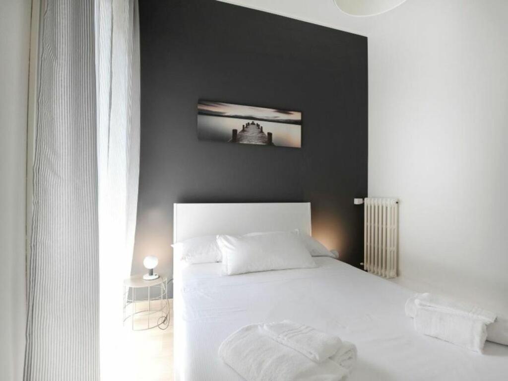A bed or beds in a room at Alberto Mario by Halldis