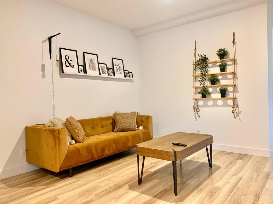 a living room with a couch and a coffee table at Le bohémien - Condos Saint-Côme in Saint Come