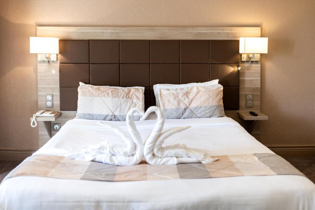 Postel nebo postele na pokoji v ubytování Hotel Regina & Spa