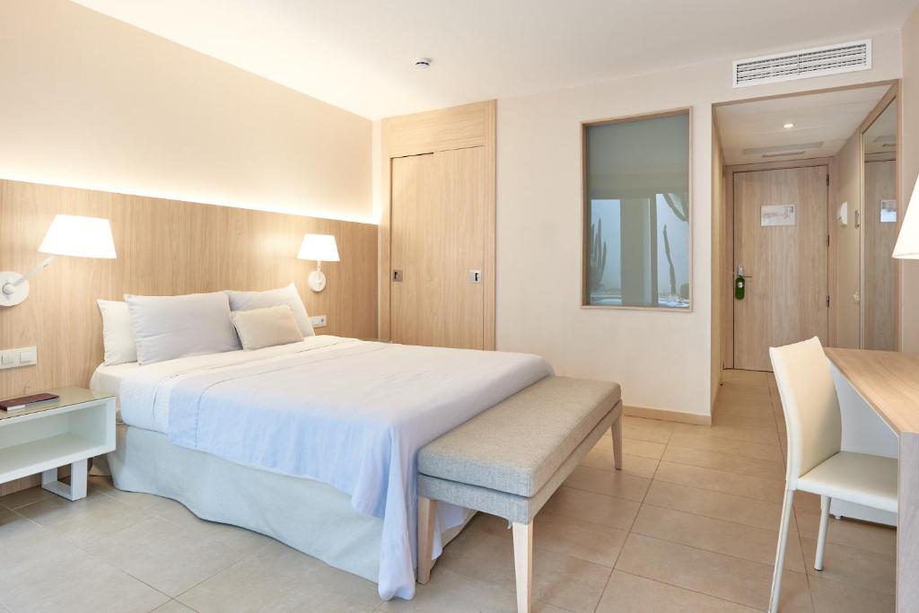 Postel nebo postele na pokoji v ubytování Hotel Omnium