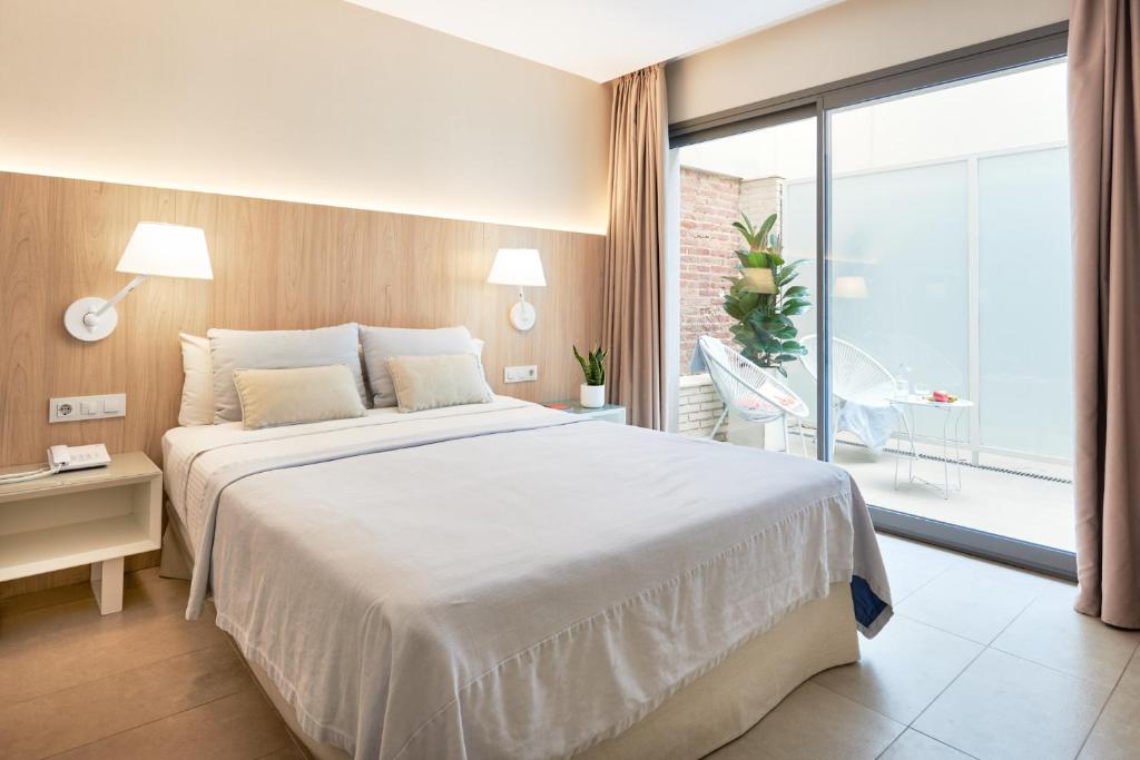 Postel nebo postele na pokoji v ubytování Hotel Omnium