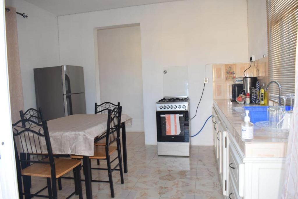 Kuchyň nebo kuchyňský kout v ubytování Oasis Kite Appartment