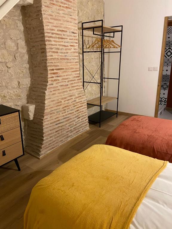Postel nebo postele na pokoji v ubytování La Charmeraie : gîte de charme, piscine et spa