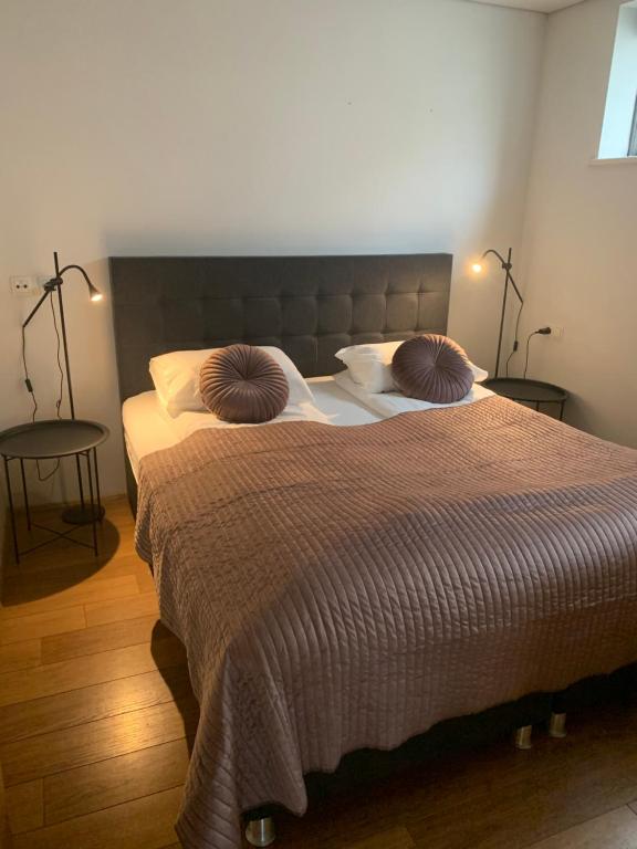 Postel nebo postele na pokoji v ubytování Mengi Apartments