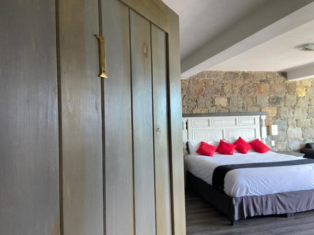 Postel nebo postele na pokoji v ubytování Vista Zacatlan Hotel