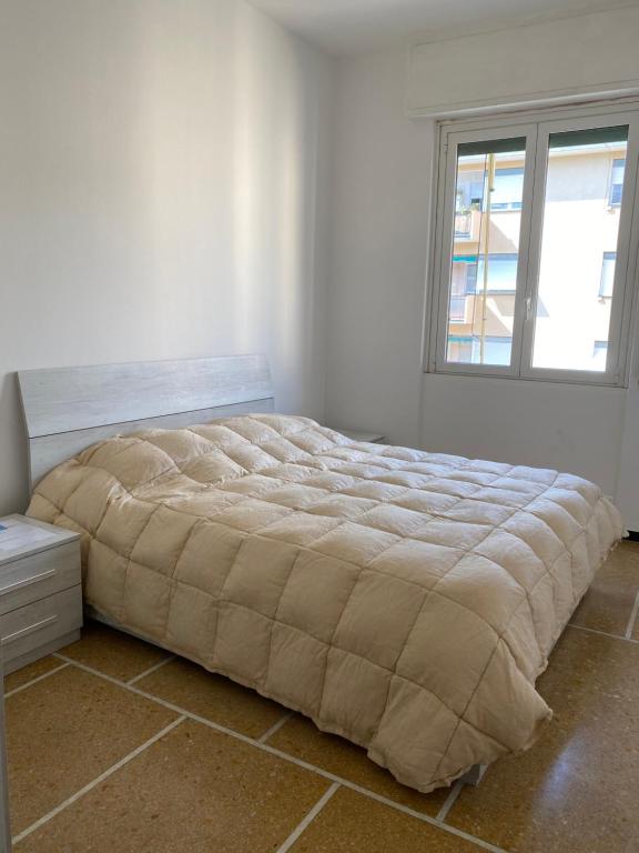 Posteľ alebo postele v izbe v ubytovaní Home Rapallo