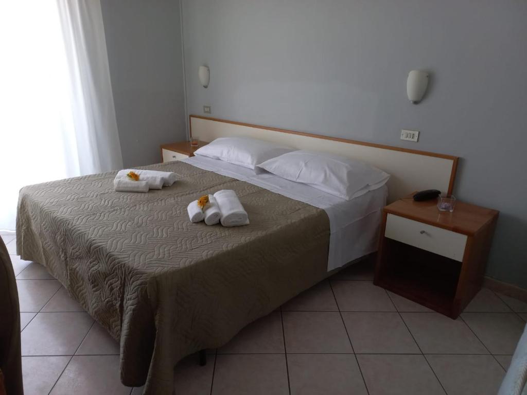 Postel nebo postele na pokoji v ubytování Hotel Venere