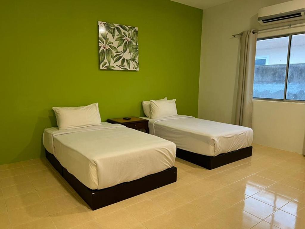 Postel nebo postele na pokoji v ubytování SANDY GARDEN RESORT LANGKAWI