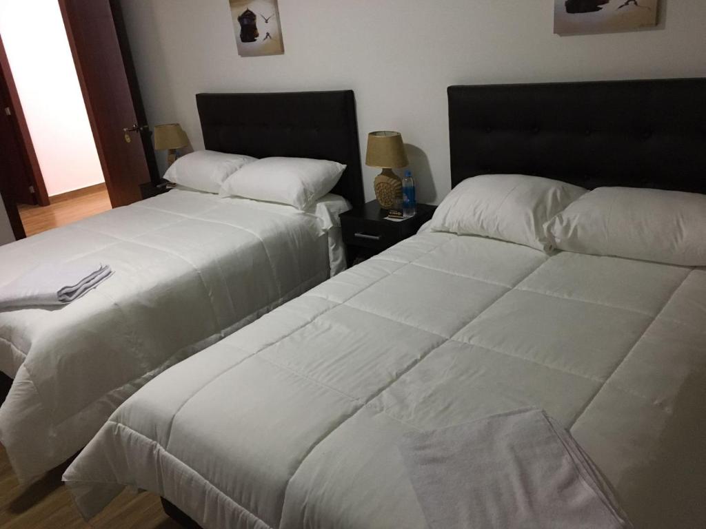 Postel nebo postele na pokoji v ubytování Hospedaje El Girasol TABABELA