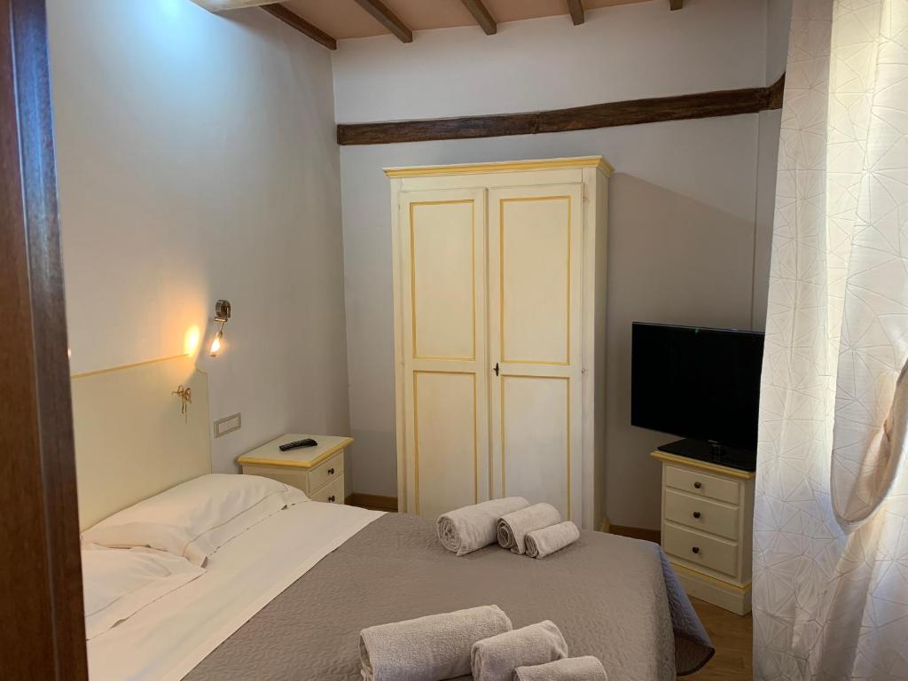 Postel nebo postele na pokoji v ubytování Residenza Via Dante