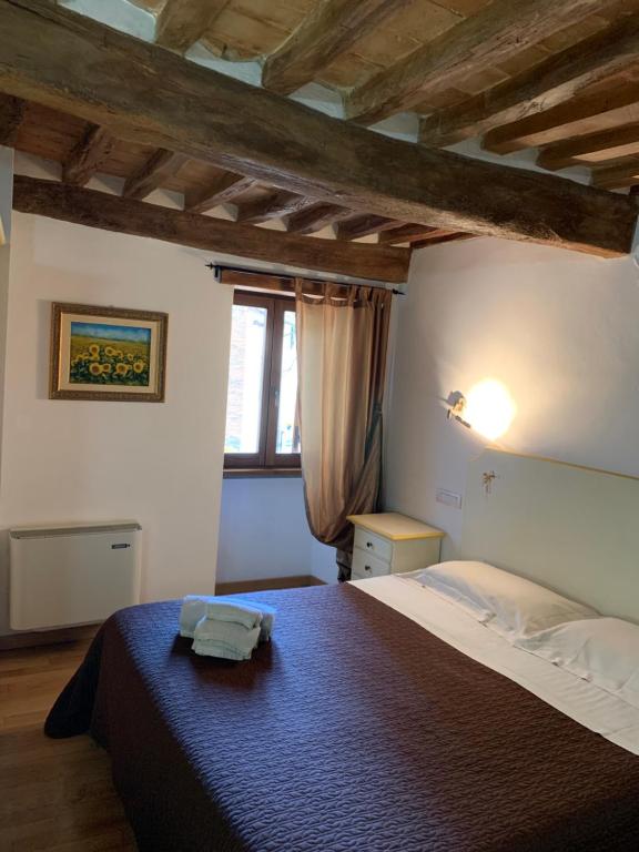 Postel nebo postele na pokoji v ubytování Residenza Via Dante