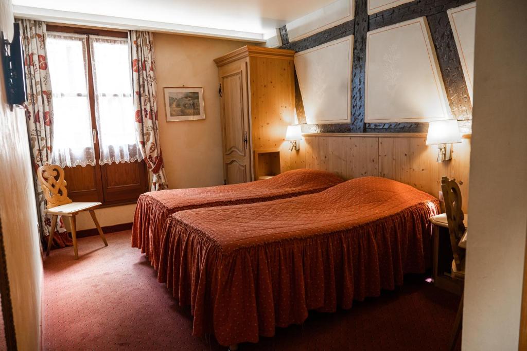 Postel nebo postele na pokoji v ubytování Hotel Saint-Martin