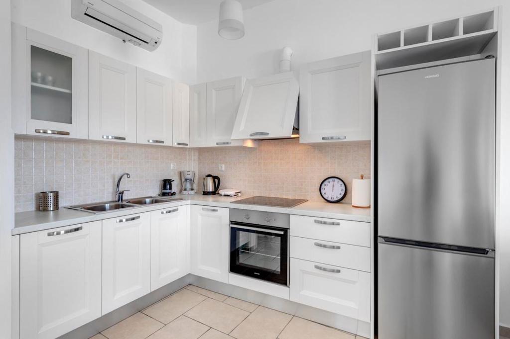 Kuchyň nebo kuchyňský kout v ubytování Waterview Apartments