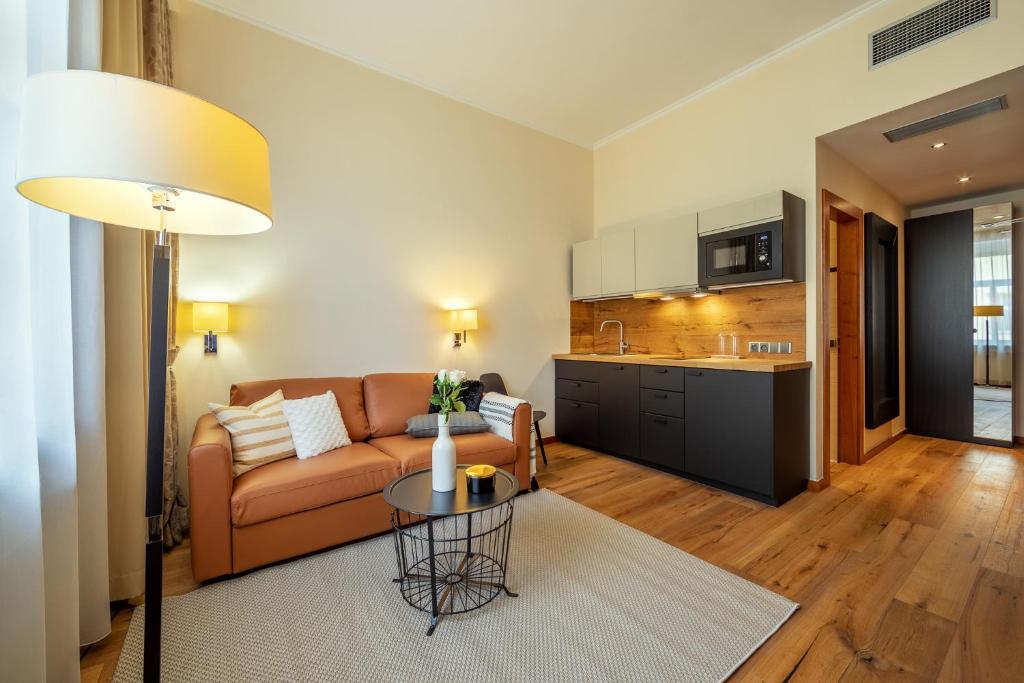 Kuchyň nebo kuchyňský kout v ubytování Design Merrion Hotel