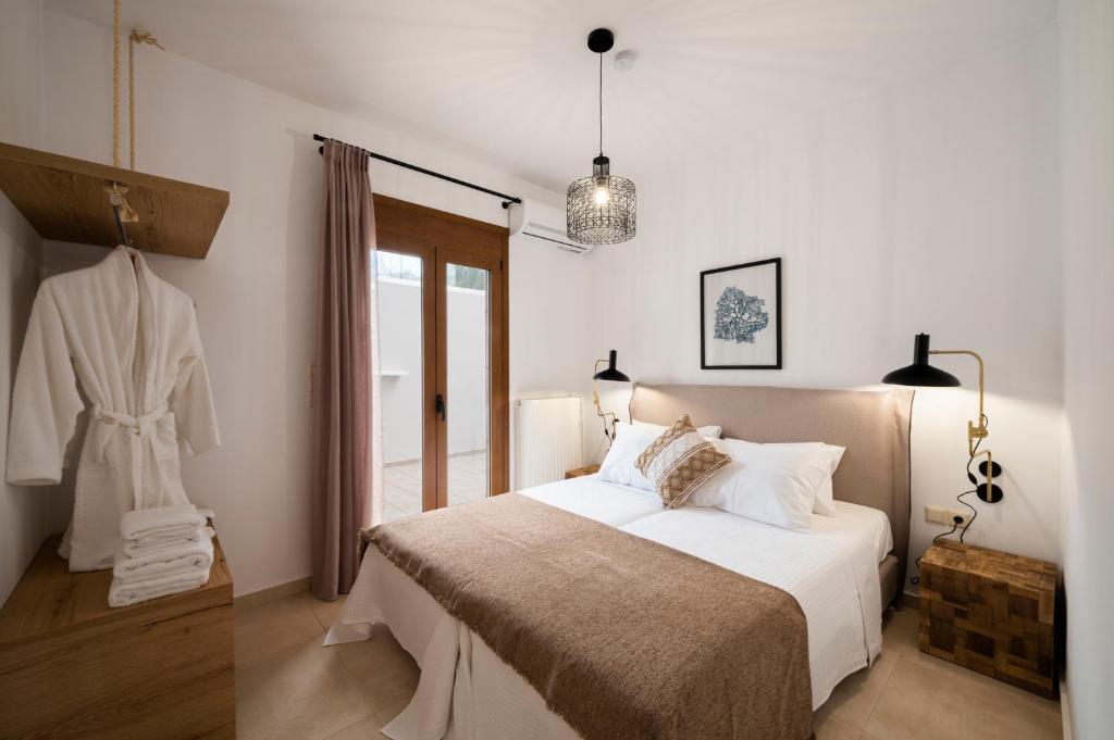 Postel nebo postele na pokoji v ubytování Zen Suites