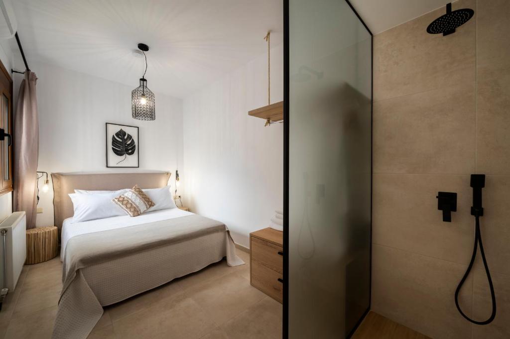Postel nebo postele na pokoji v ubytování Zen Suites