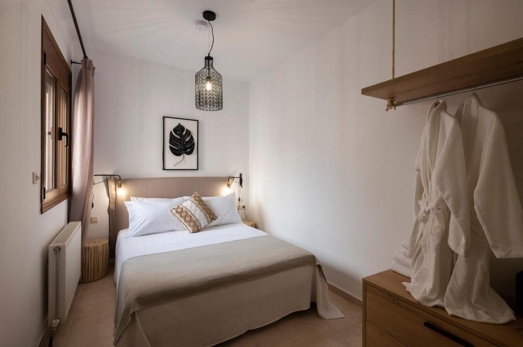 Postel nebo postele na pokoji v ubytování Zen Suites