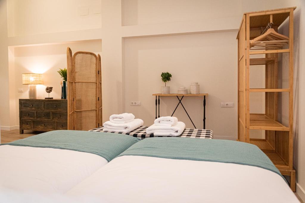 Posteľ alebo postele v izbe v ubytovaní La Casa del Pintor Apartments