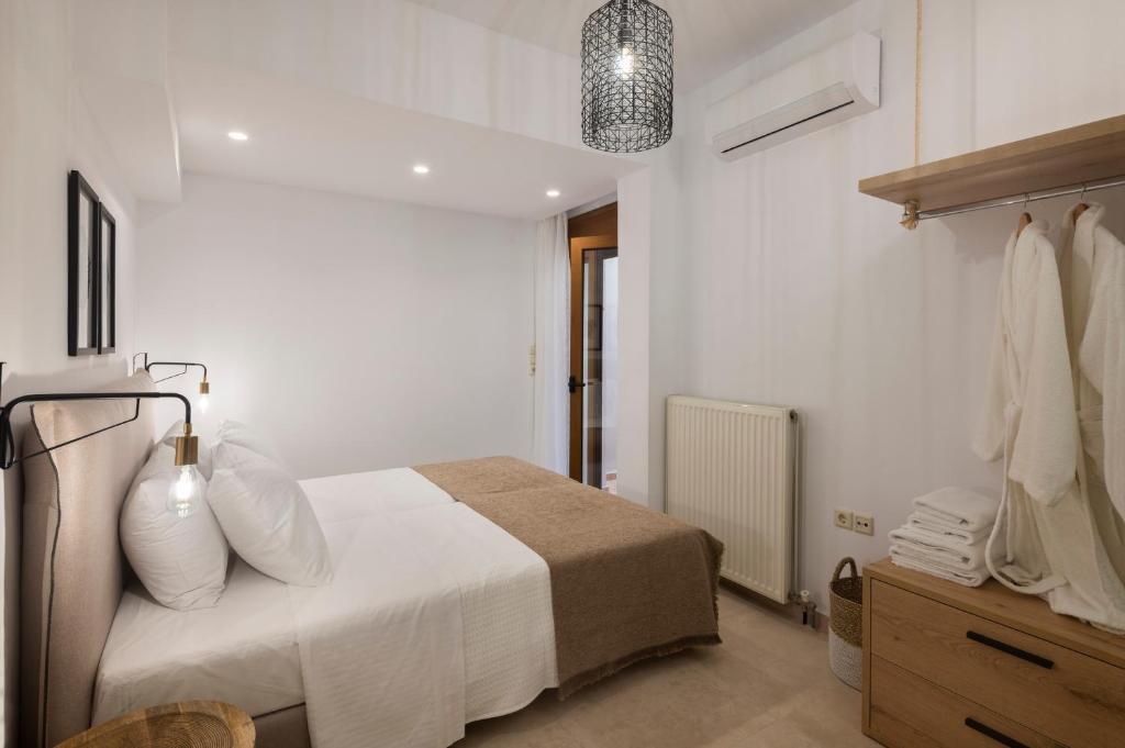 Postel nebo postele na pokoji v ubytování Zen Suites